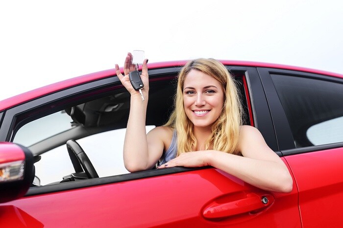 Woman_Showing_Keys_Sitting_In_Car.jpg