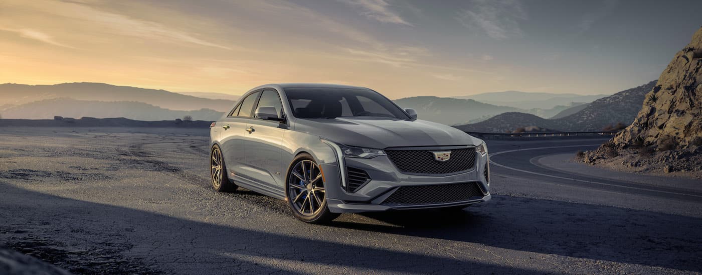 A grey 2024 Cadillac CT4-V for sale is shown from the front at an angle.