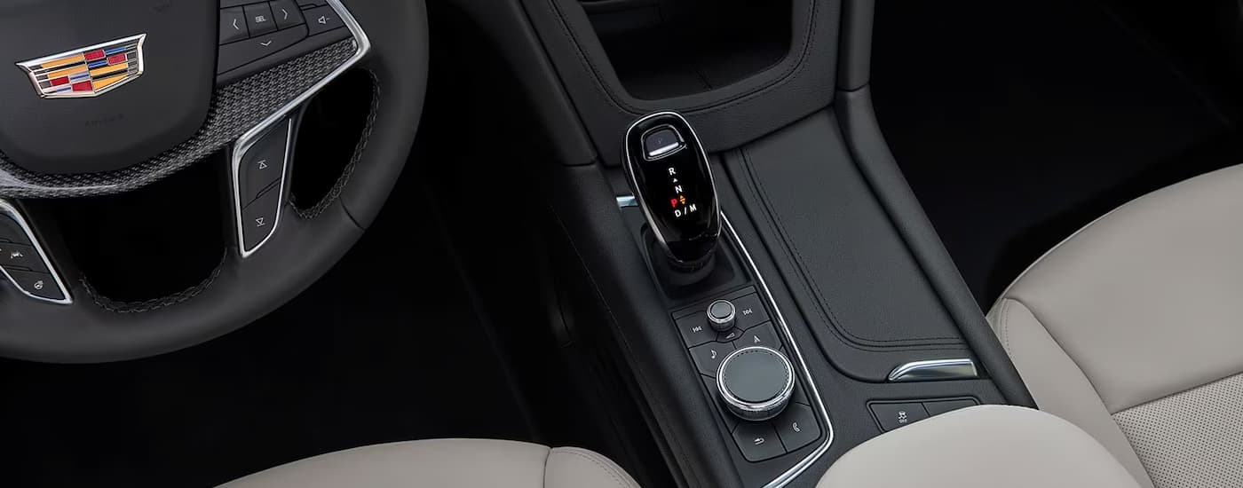 A close up of the center console of a 2023 Cadillac XT5 is shown.