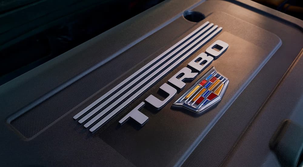 A close up of the turbo badge on a 2024 Cadillac XT4 is shown.