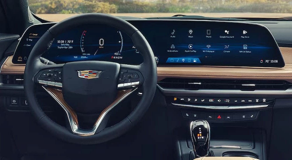 The black and brown interior and dash in a 2024 Cadillac XT4 is shown.