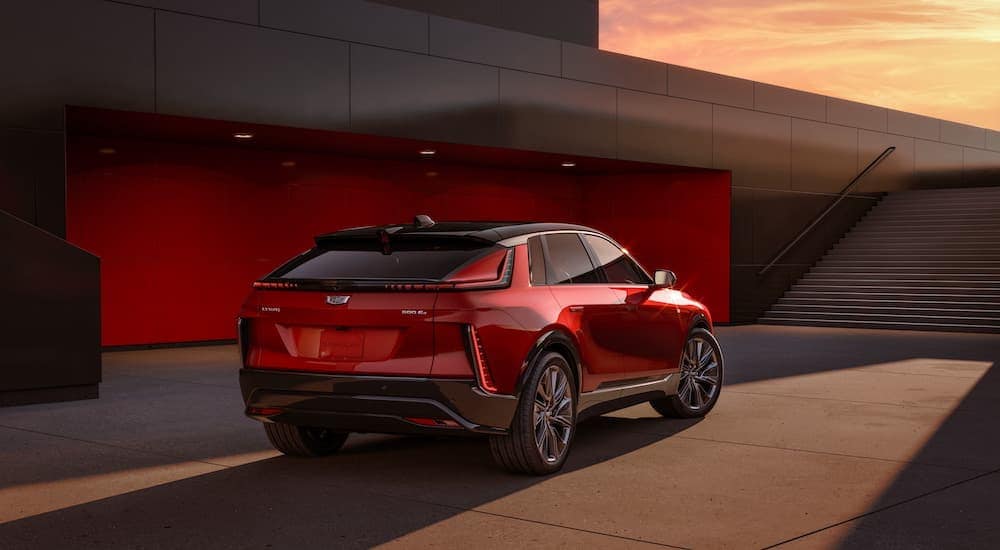 A red 2024 Cadillac LYRIQ is shown from the rear at an angle.