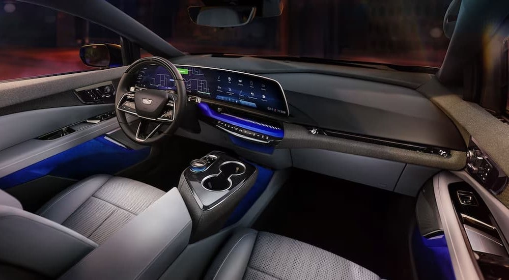 The black and gray interior and dash in a 2025 Cadillac OPTIQ is shown.