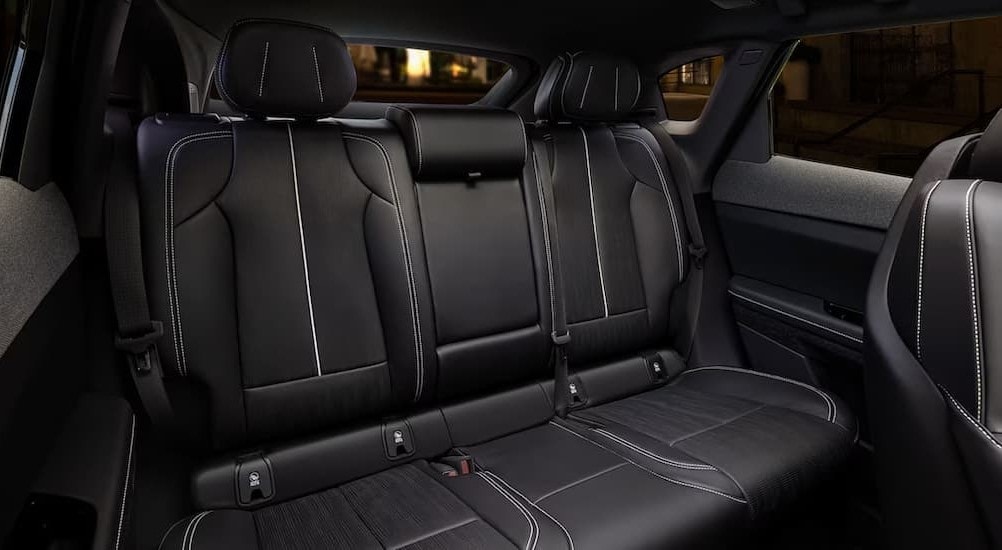 The black rear seats in a 2025 Cadillac OPTIQ is shown.