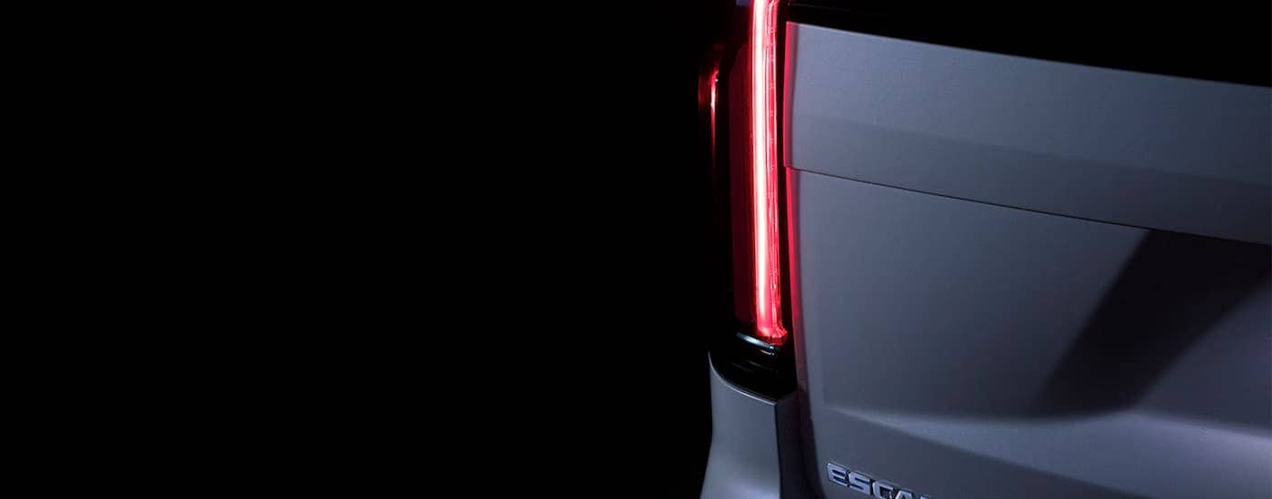 A close up of the rear brakelight on a silver 2024 Cadillac Escalade.