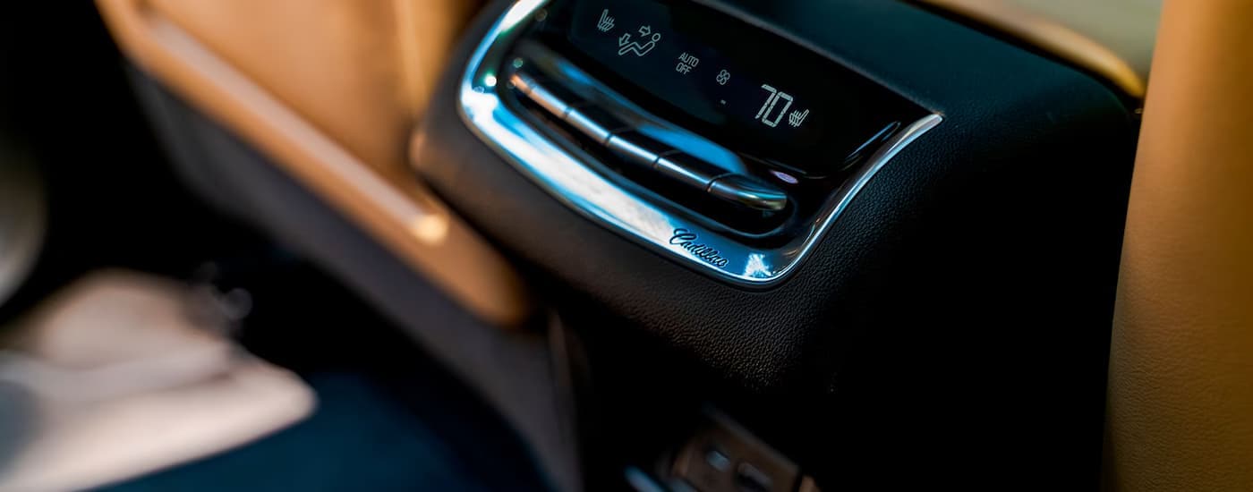 A close up of the temperature settings in the back of a 2025 Cadillac XT6 for sale in New York City.