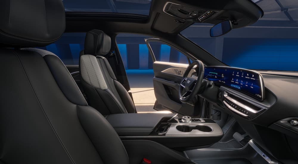 The black interior of a 2024 Cadillac LYRIQ is shown from the passenger side after leaving a Cadillac dealer near Englewood.