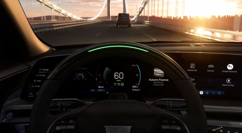 A close up of the steering wheel of a 2023 Cadillac LYRIQ is shown.