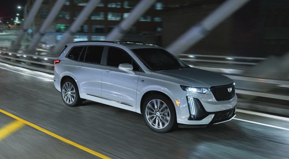 A white 2024 Cadillac XT6 is shown from the front at an angle.