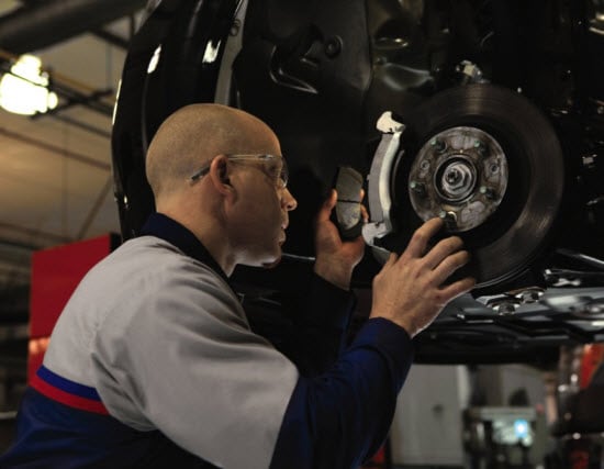Service Tech Working on Brakes