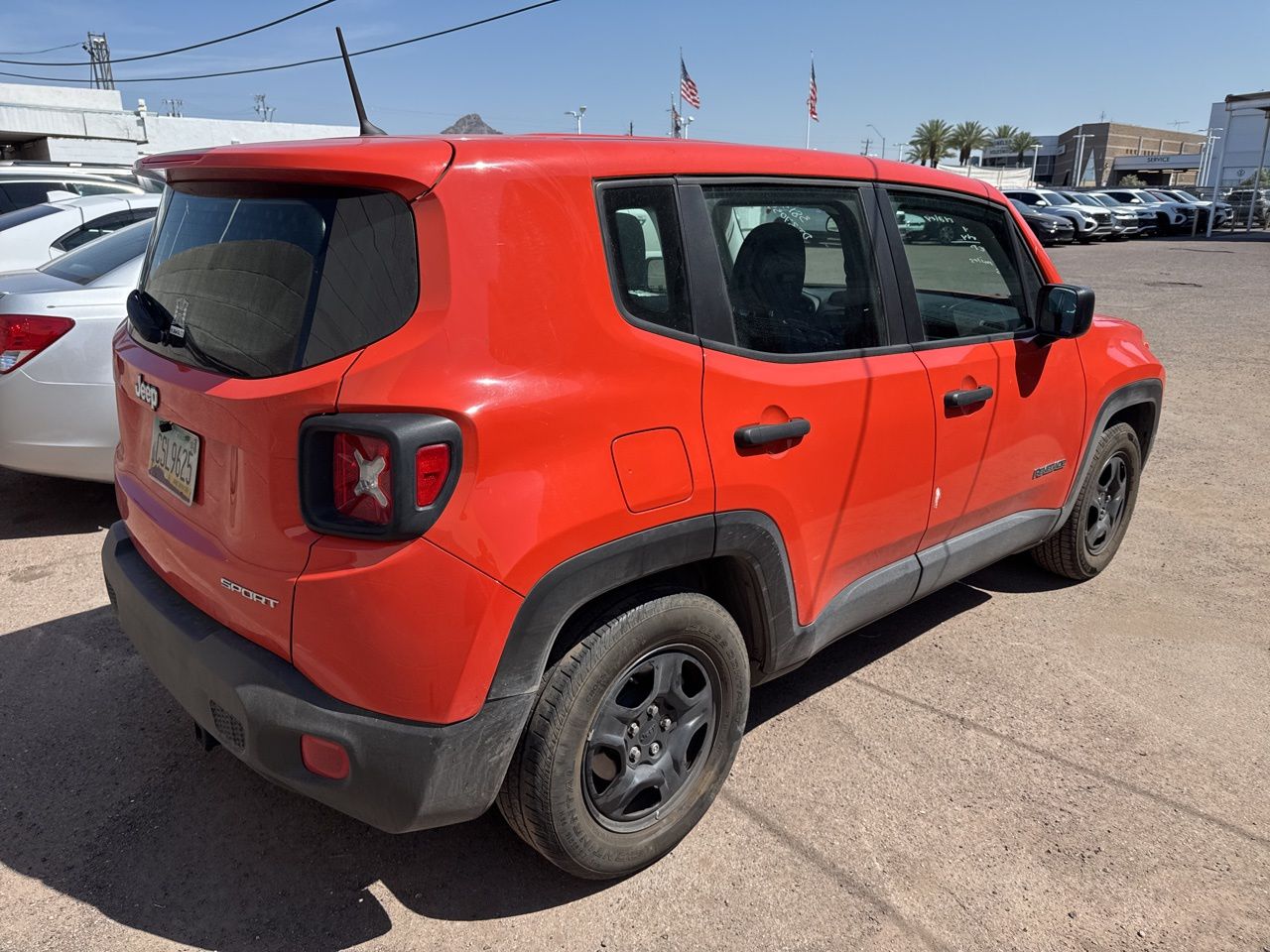 Used 2017 Omaha Orange Jeep Sport image 9