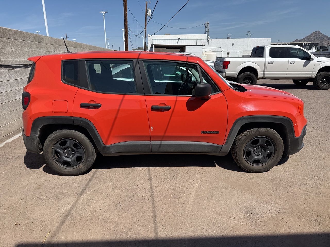 Used 2017 Omaha Orange Jeep Sport image 10