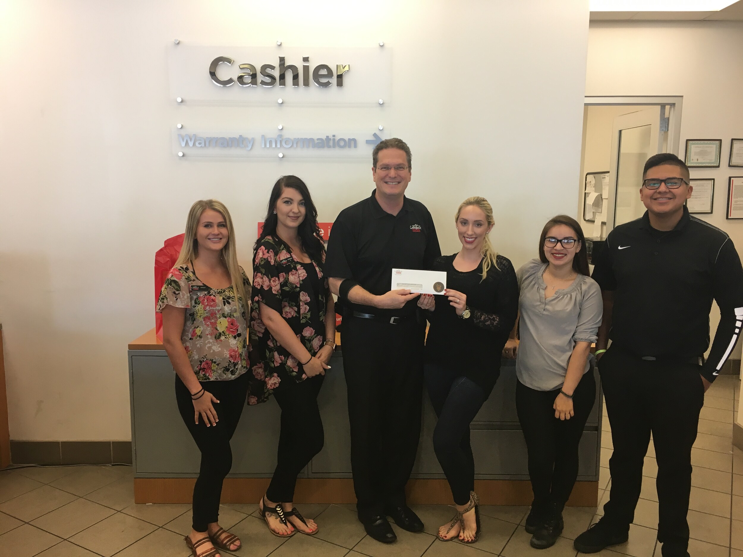 Camelback Toyota presenting American Heart Association with check