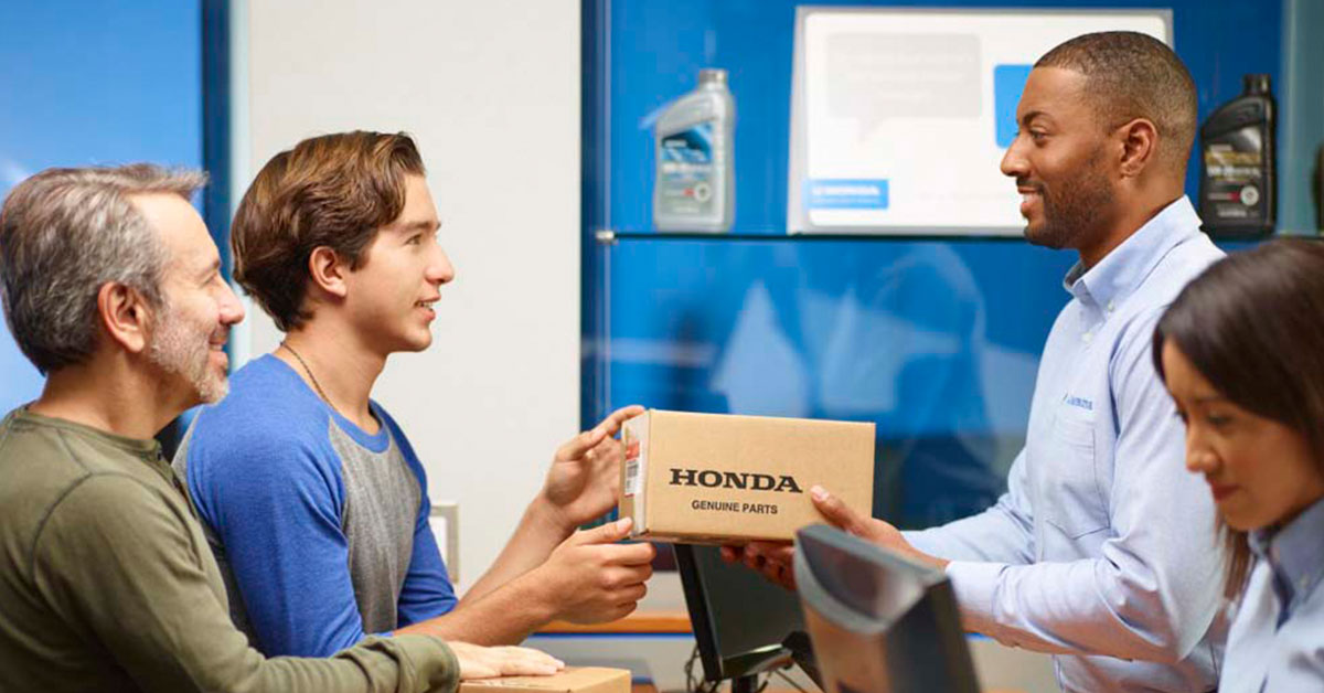 Customer picking up Honda parts from a dealership