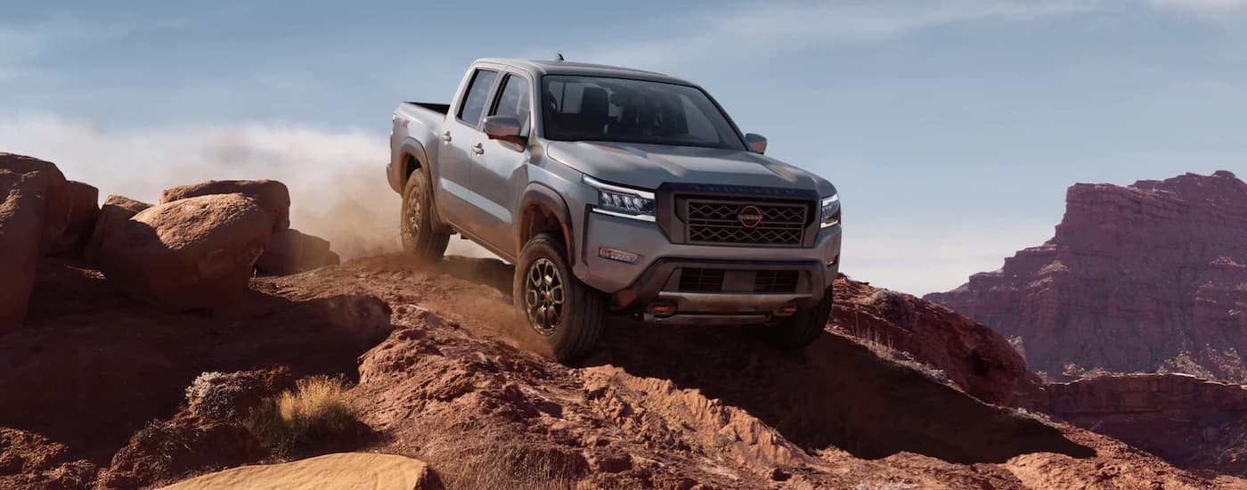 A silver 2022 Nissan Frontier from the front at an angle.