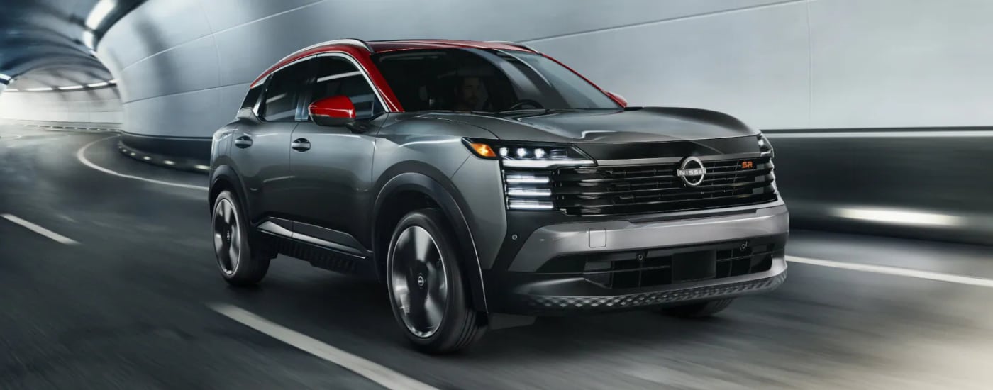 Silver 2026 Nissan Kicks SR for sale near Green Bay on a test drive through a tunnel