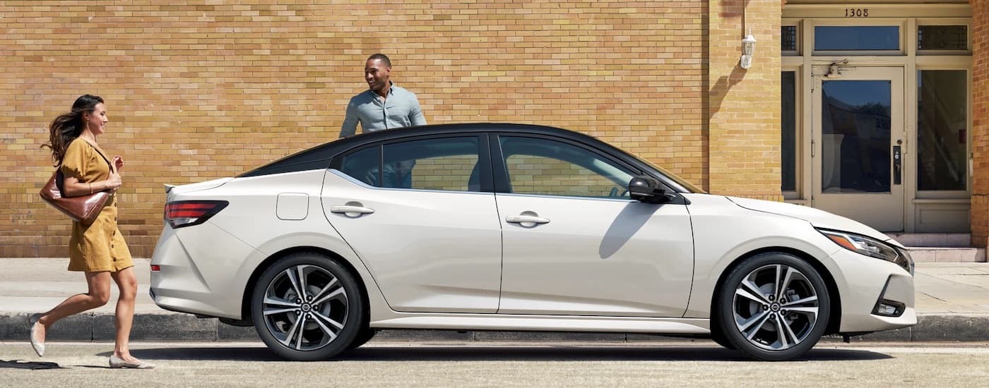 A white 2023 Nissan Sentra from the side.