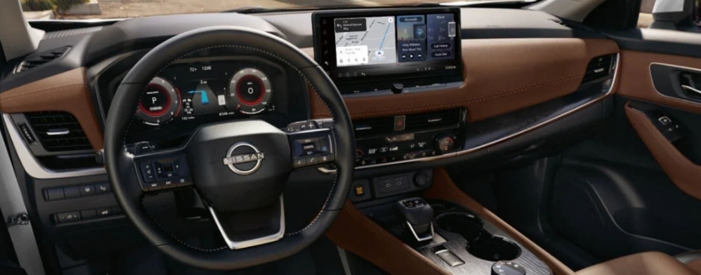 The brown interior of a 2025 Nissan Rogue for sale is shown.