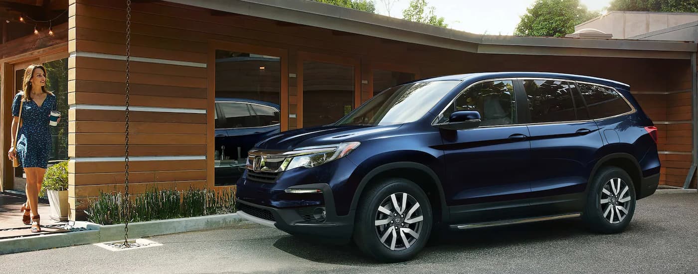 Blue 2022 Honda Pilot parked in a driveway