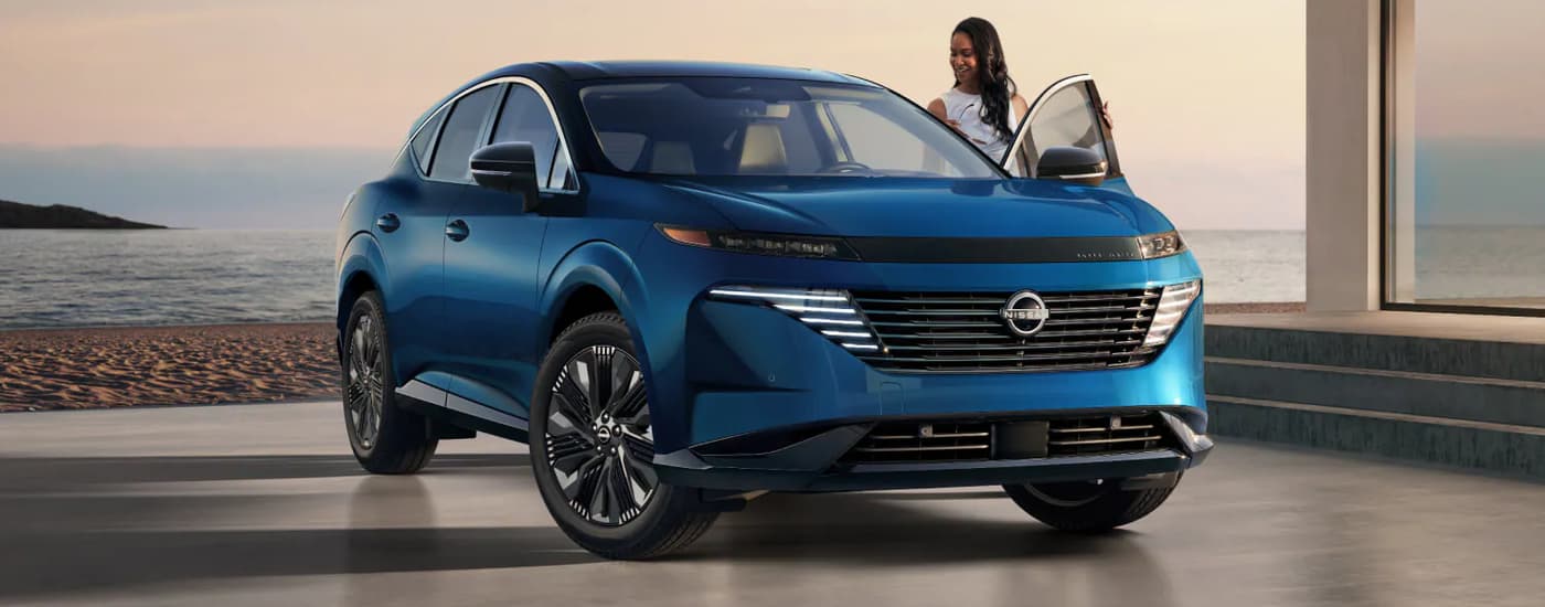 Blue 2025 Nissan Murano Platinum parked at a Nissan dealer near D'lberville