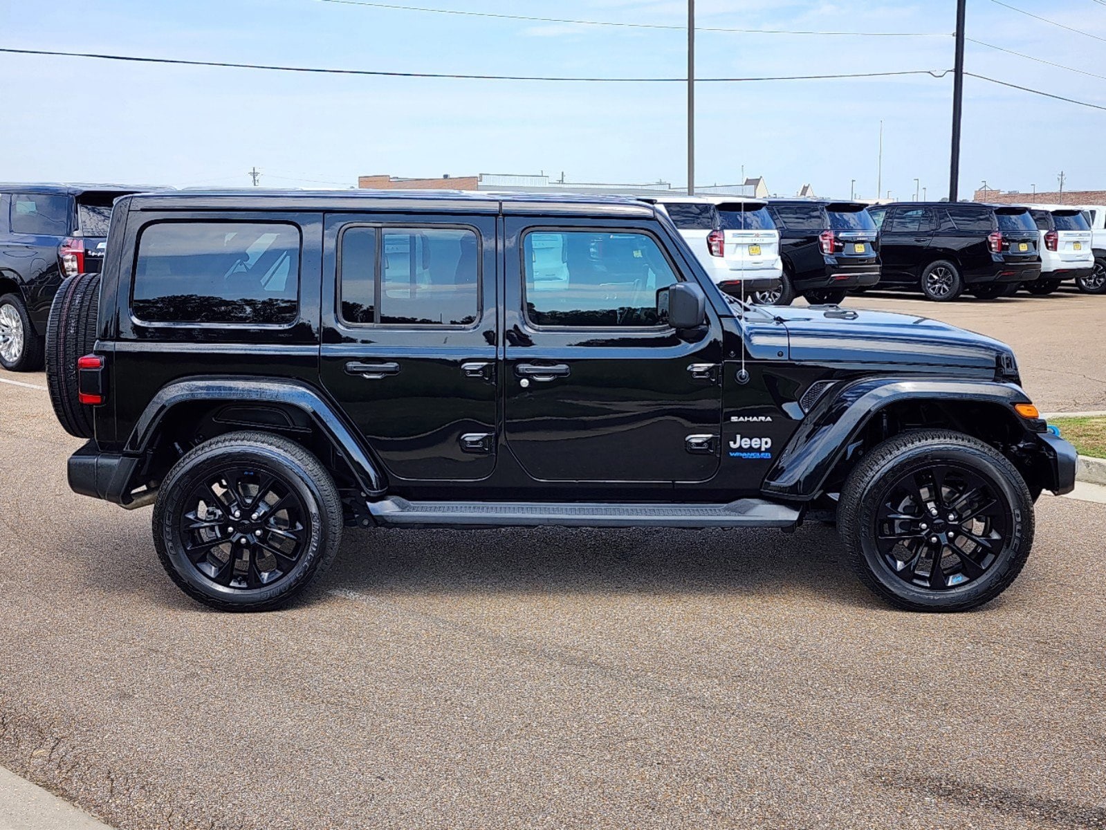 Used 2022 Jeep Wrangler Unlimited Sahara 4XE with VIN 1C4JJXP62NW198136 for sale in Madison, MS