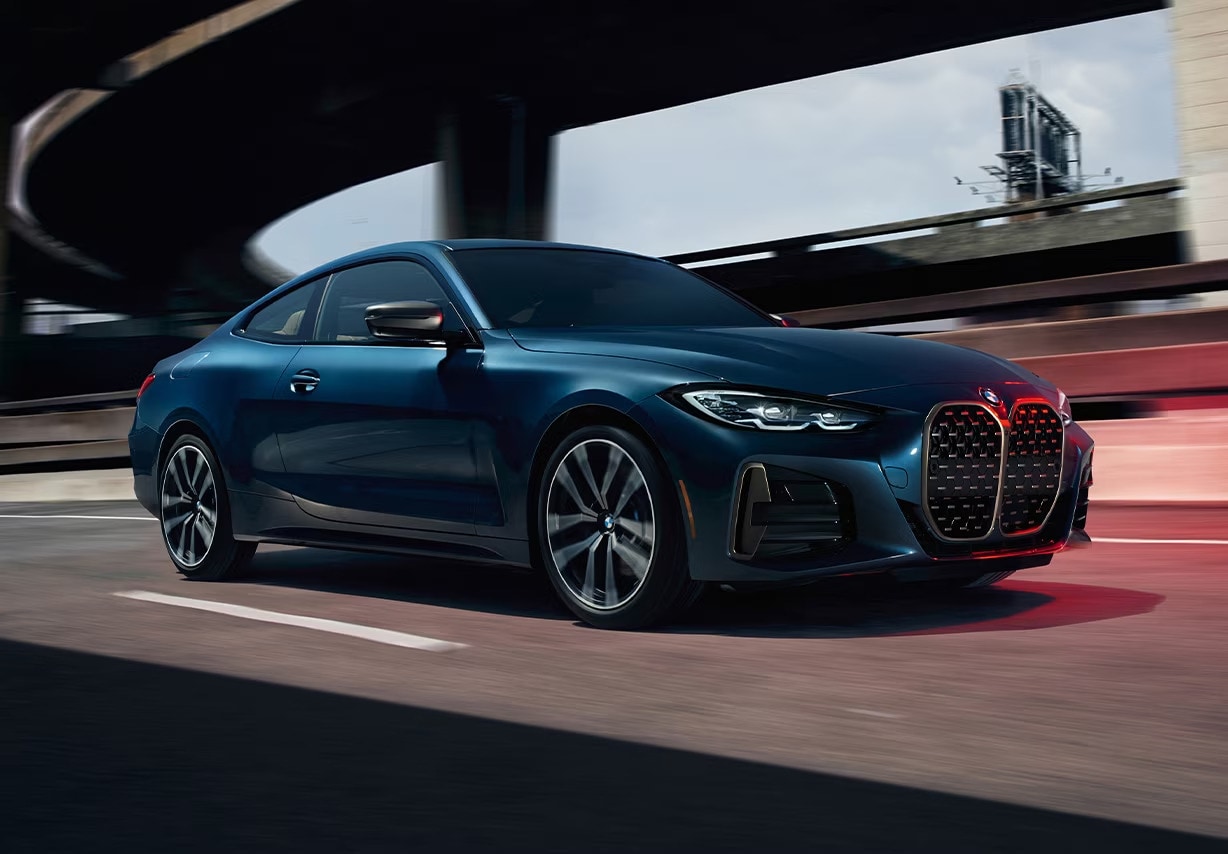 Angled photo of BMW 4 Series driving on freeway