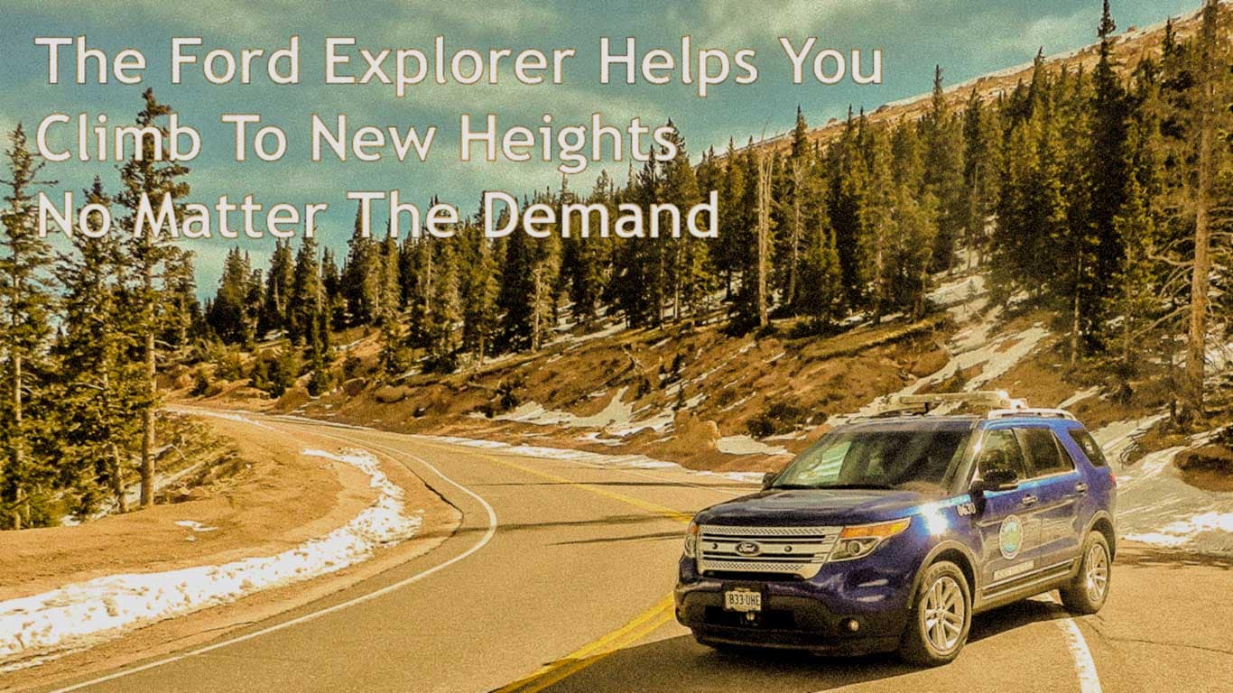 A dark blue Ford Explorer with lightbars on the roof sits on the side of a road on a mountain. The article is about Ford Explorer problems.