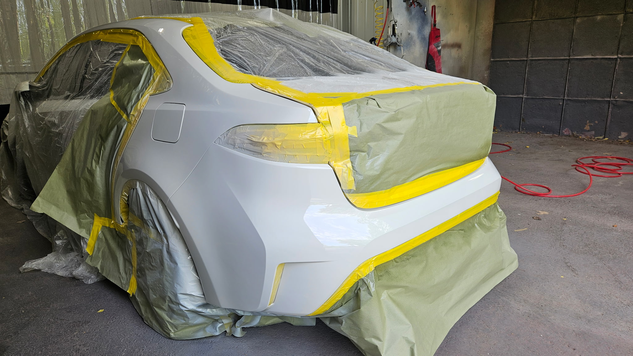 Vehicle bumper repair and paint matching at Car City Wholesale's body shop in Shawnee, KS