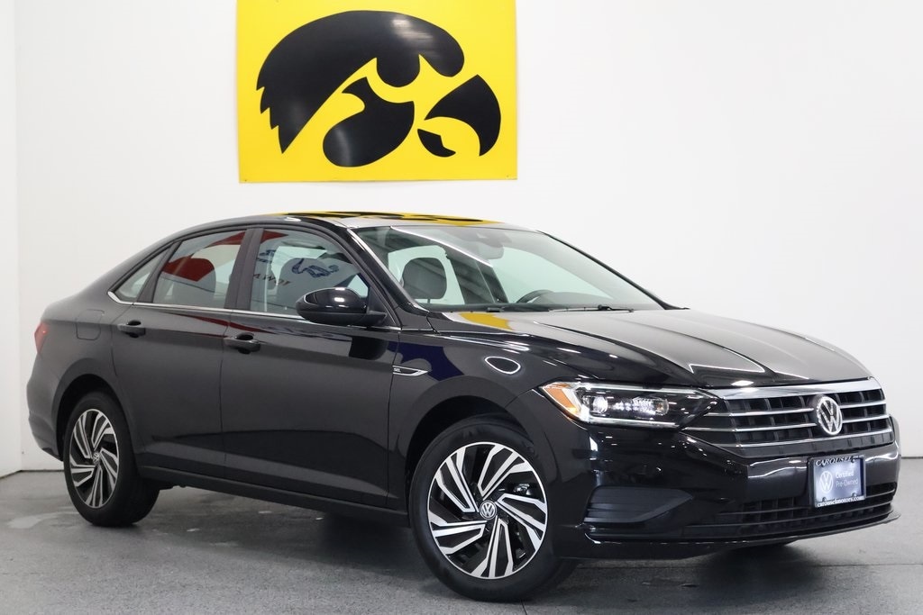 Used 2021 Volkswagen Jetta SEL with VIN 3VWE57BU1MM027028 for sale in Iowa City, IA