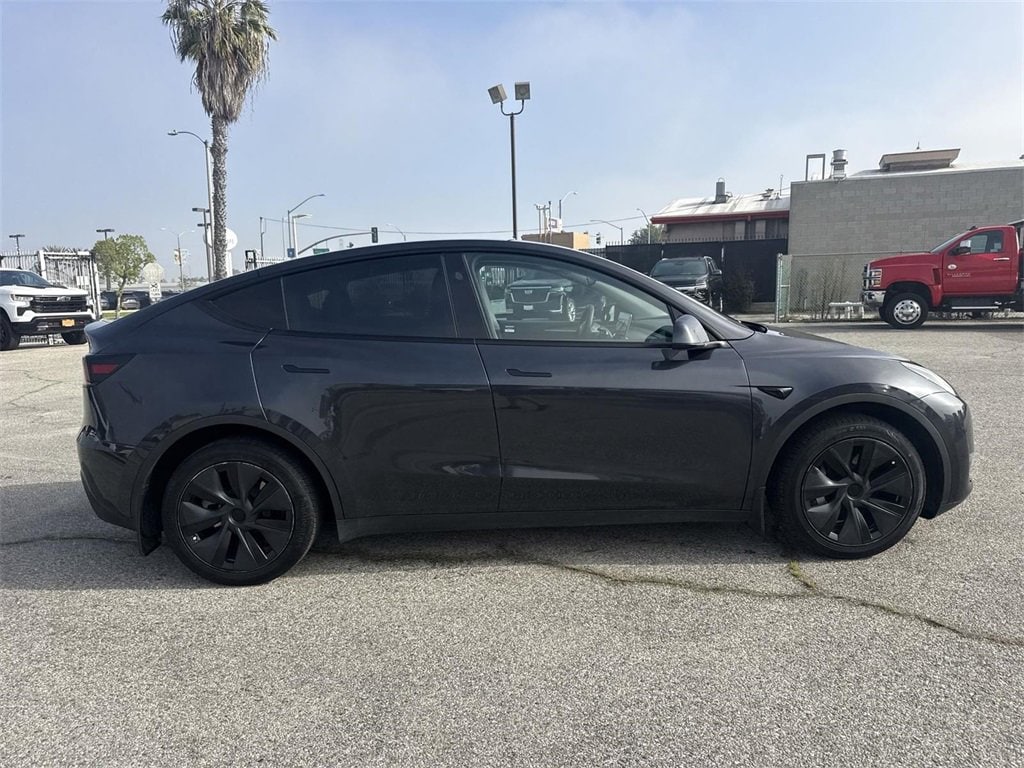 Used 2024 Tesla Model Y Long Range with VIN 7SAYGDED7RF205530 for sale in Kansas City