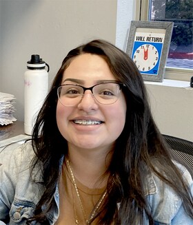 Staff member Estrella Burciga from 18f82b82a1b2