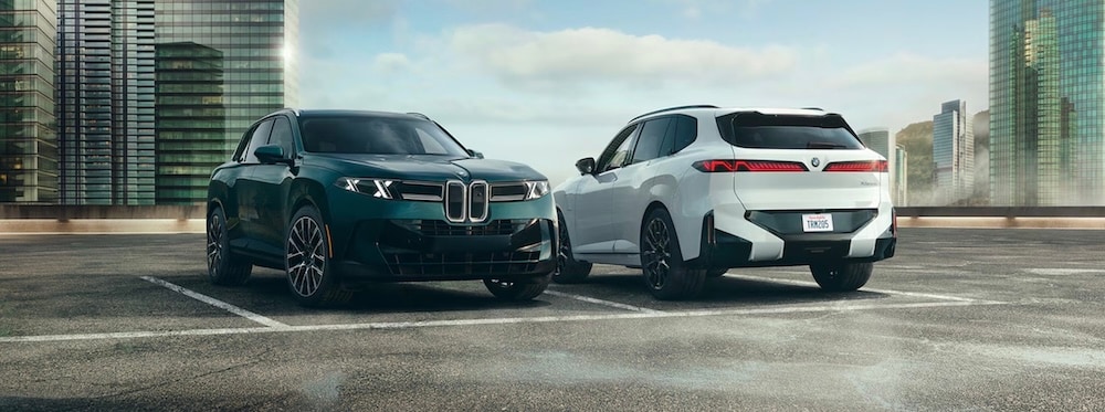 Two BMW X5 SUVs parked on a rooftop