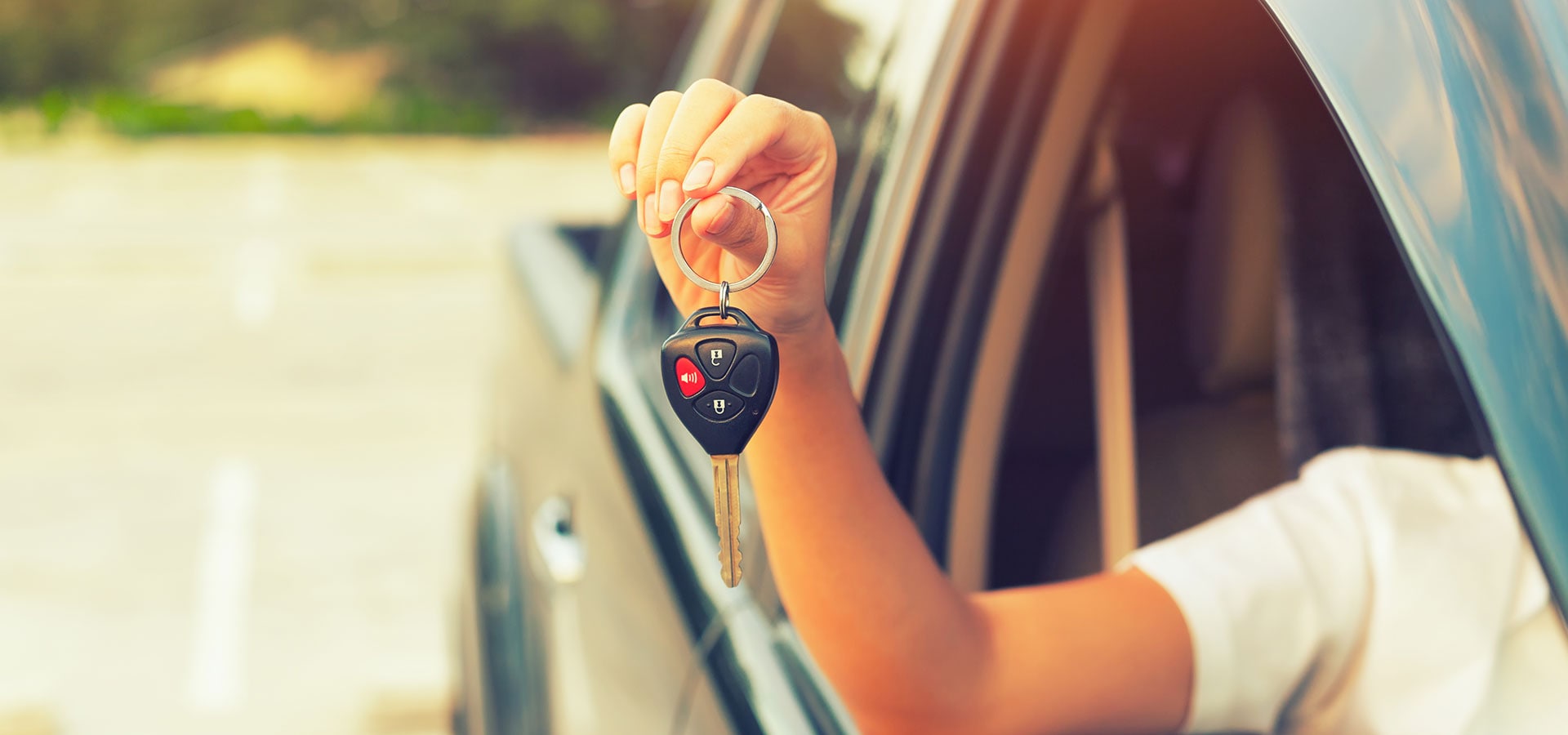 Customer showing off the keys to their pre-owned vehicle