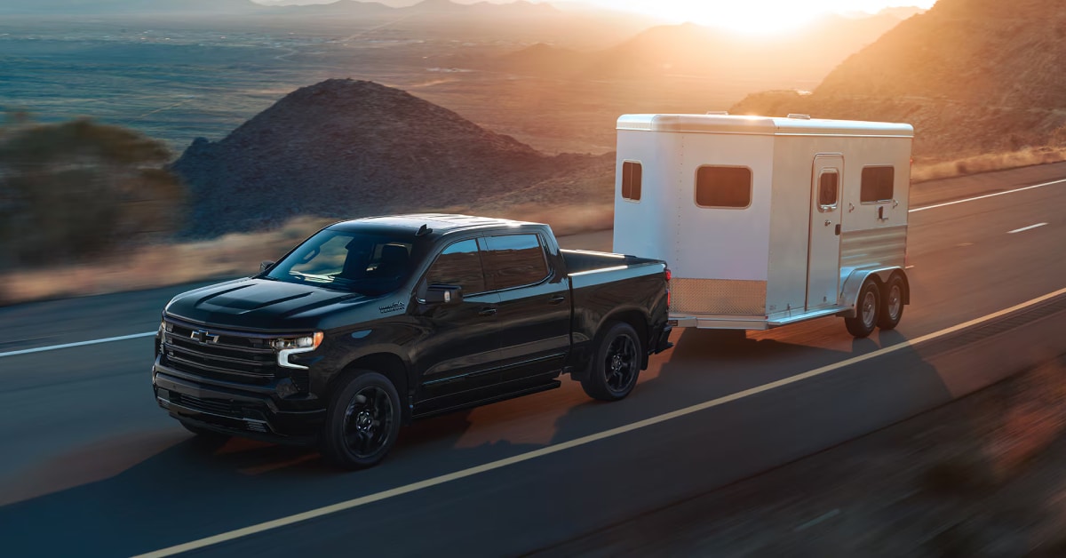 2025%20Chevy%20Silverado%201500%20High%20Country%20Trim%20hauling%20a%20trailer%20on%20the%20road.jpg