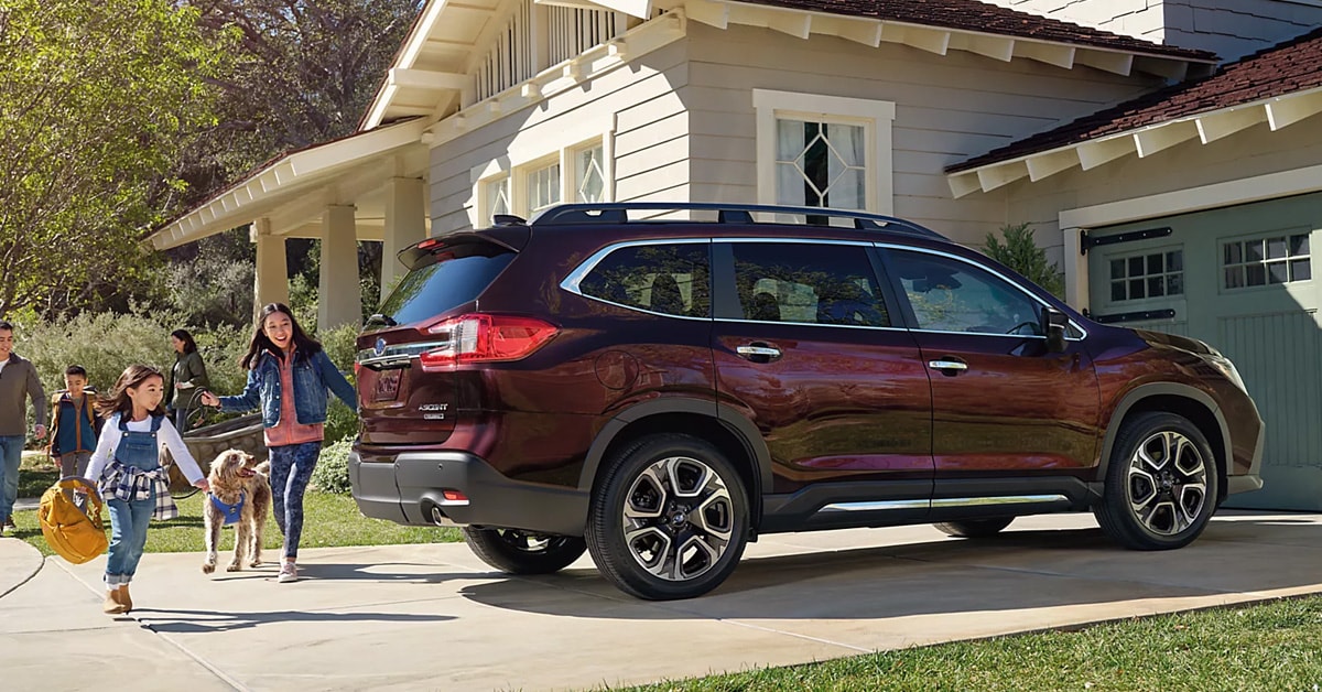 A%202026%20Subaru%20Ascent%20parked%20outside%20a%20house%20with%20a%20woman%20looking%20nearby.jpg