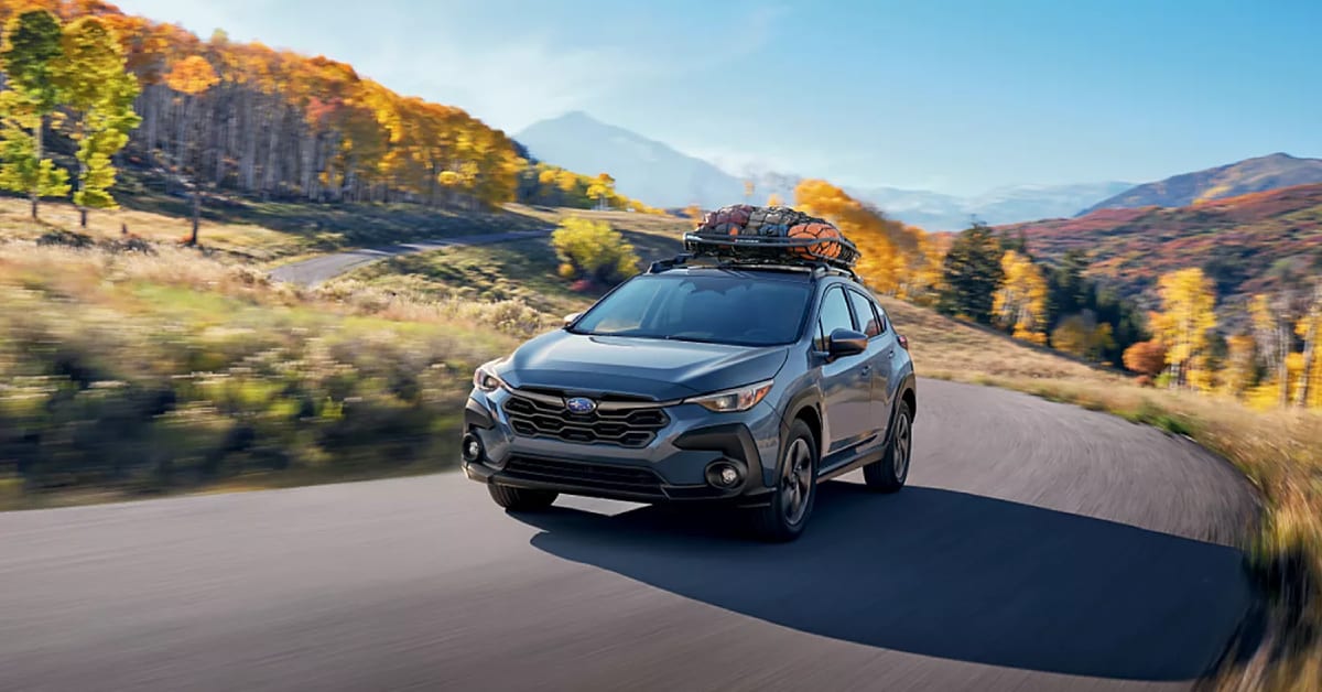 2025%20Subaru%20Crosstrek%20driving%20in%20the%20country.jpg
