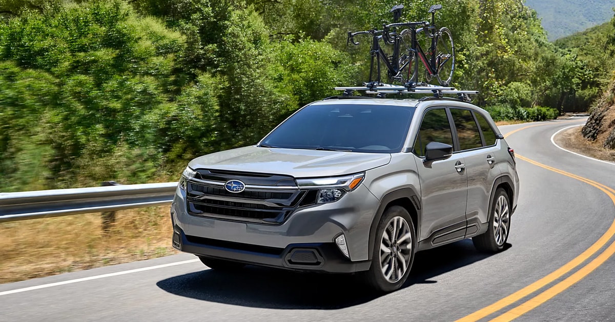 2025 Forester on the road with bikes mounted on top.jpg