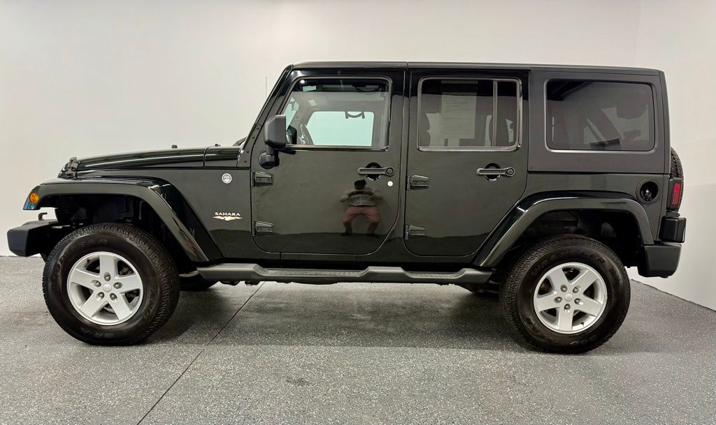 Used 2012 Jeep Wrangler Unlimited Sahara with VIN 1C4HJWEG2CL165141 for sale in Springfield, VT