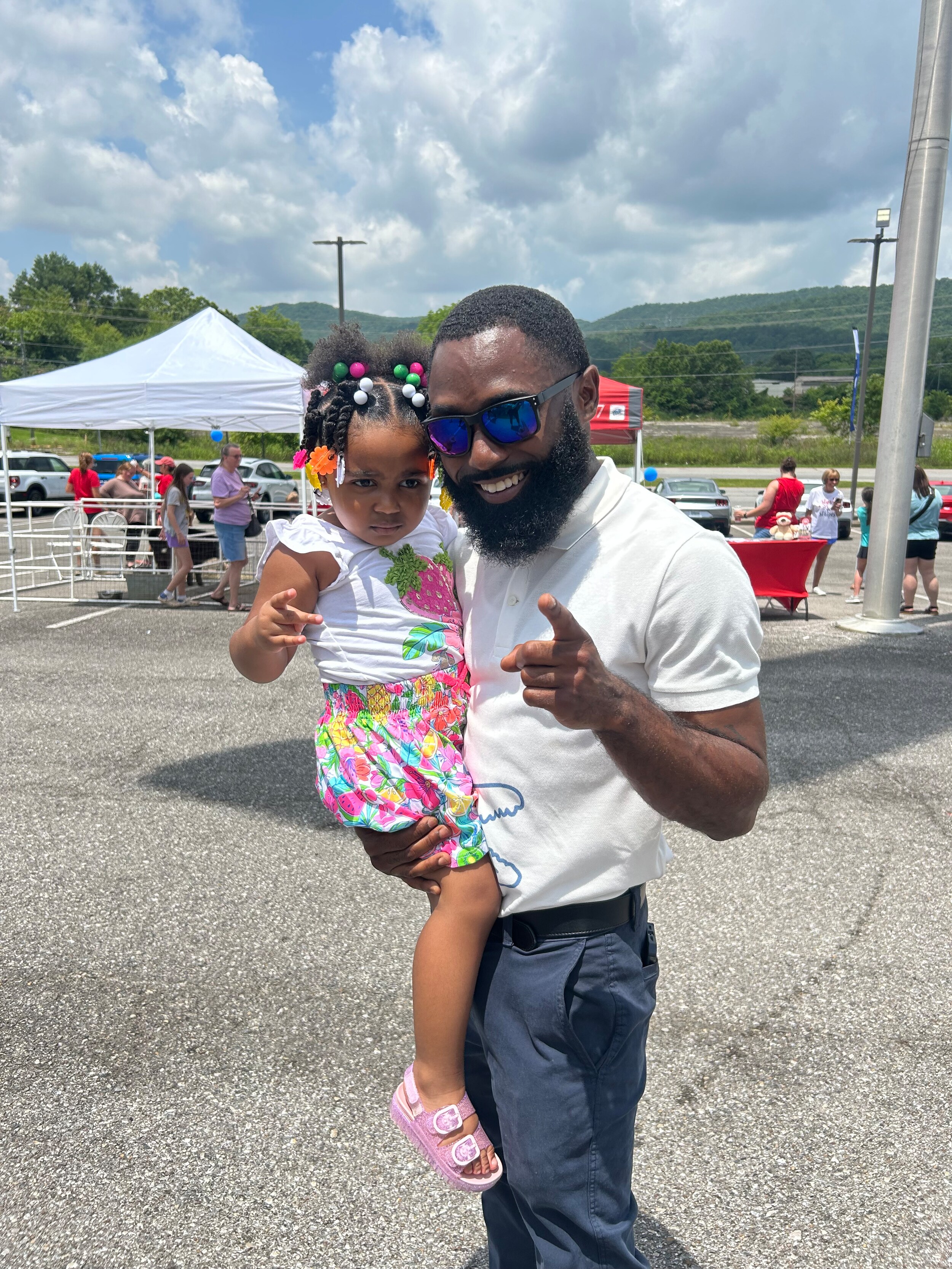 Ford Salesman with daughter at grand opening event