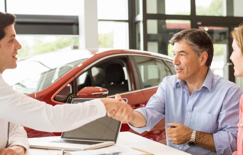 couple buys car