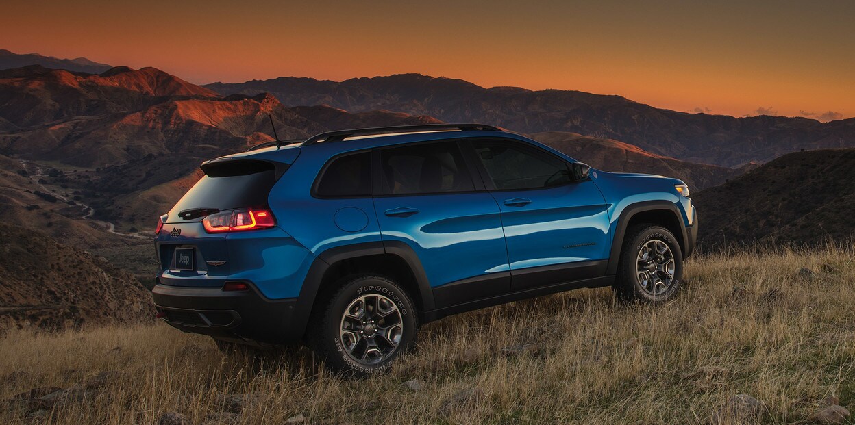 2021 Jeep Cherokee In Blue Parked off-road at night