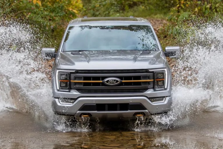 2021 ford f-150 silver driving through water