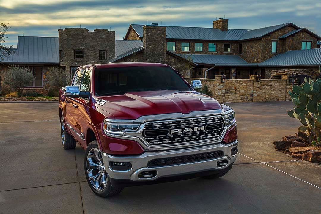 front view of the 2021 RAM 1500 Limited parked close to a house