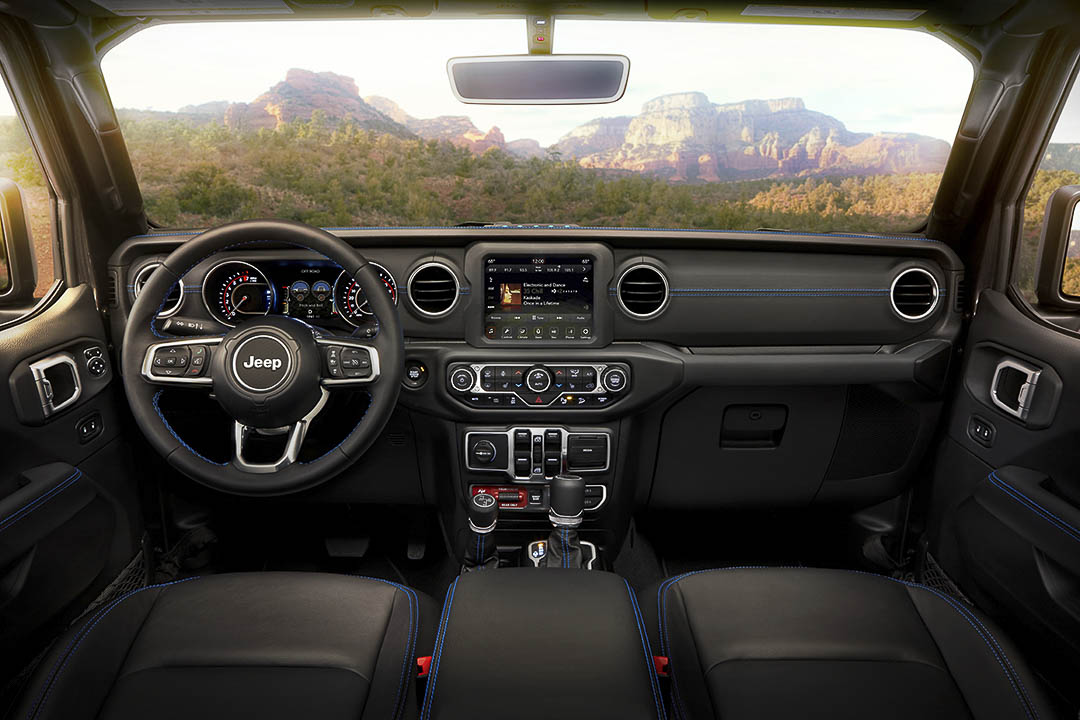 Front cockpit of a Jeep Wrangler Rubicon 4xe including its dashboard with all its technologies