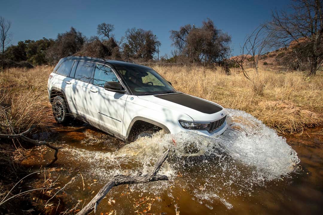 lateral view of the 2022 Jeep Grand Cherokee 4xe entering a body of water
