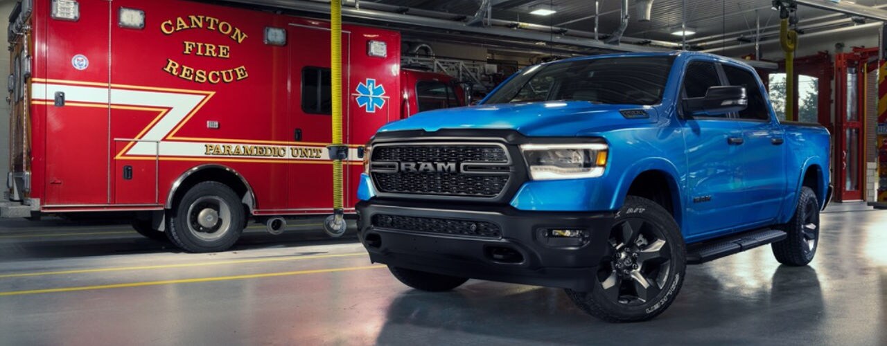 front side view of a 2023 RAM 1500 truck in a fire station