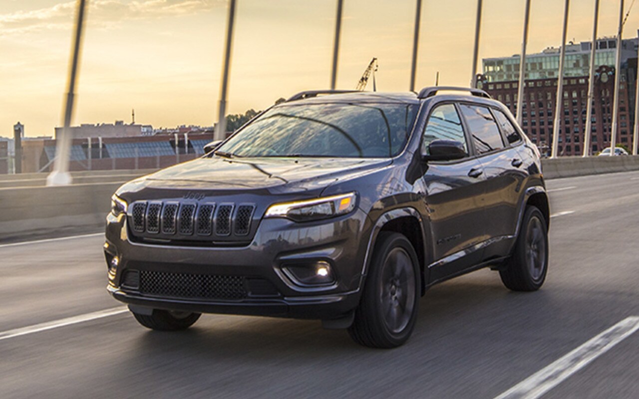 front side view of a 2023 Jeep Cherokee on a bridge