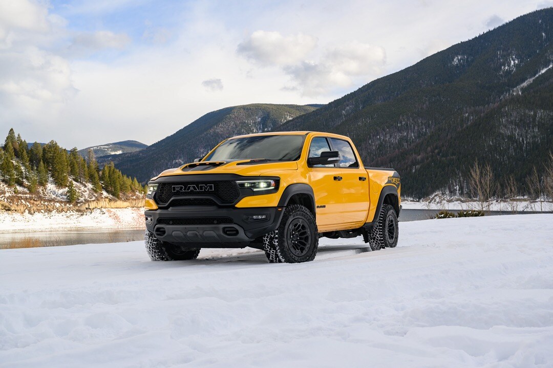 Front 3/4 view of 2023 RAM 1500 TRX Havoc edition parked on snow in nature.