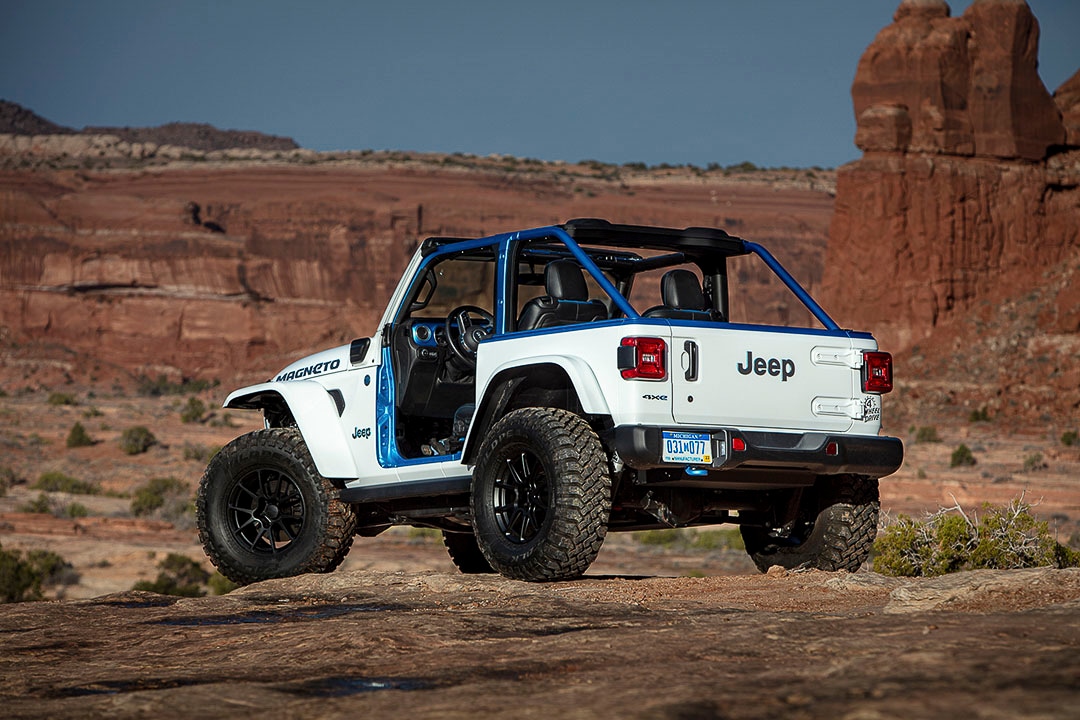 rear side view of a 2023 Jeep Wrangler Magneto in a canyon