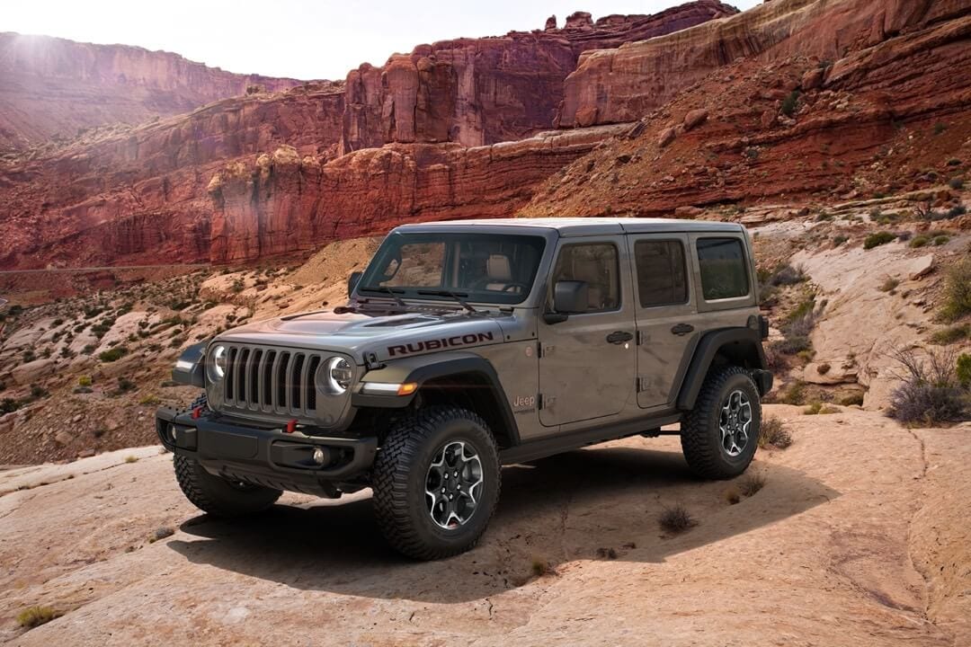 Side view of a 2023 Jeep Wrangler in a canyon